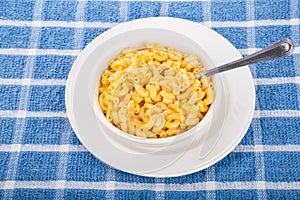 Mac and Cheese in White Bowl on Blue Towel photo