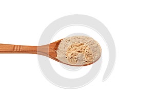 Maca gelatinized flour. Maca Powder in wooden spoon isolated on white, close-up. Peruvian superfood, natural organic supplement