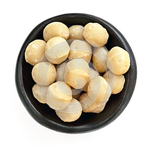 Macadamia Nuts in Black Bowl Overhead View Isolated