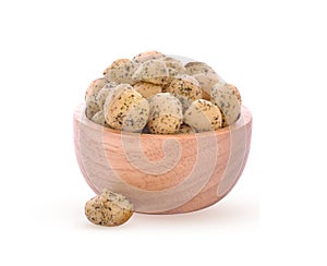 Macadamia nuts mixed with seaweed in a wooden bowl Peeled macadamia nuts isolated on white background