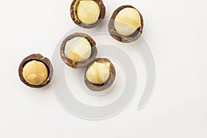 Macadamia nuts in a school isolated on white background