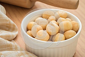 Macadamia nuts in white bowl