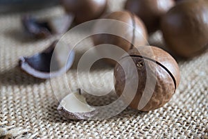 macadamia nuts on wooden table background