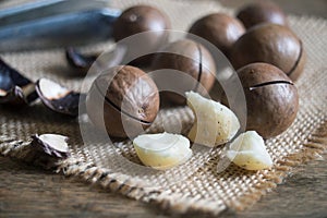 macadamia nuts on wooden table background