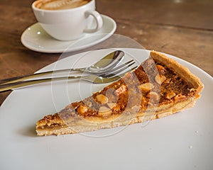 macadamia pie on a dish and coffee