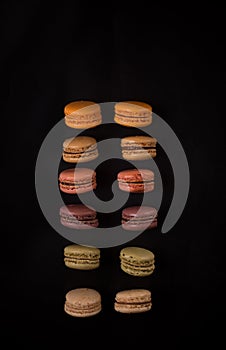 Macaron cookies on black background