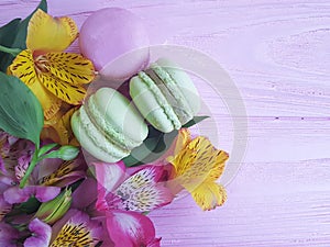 Macaron mint pink wooden background, biscuit , flower,gourmet flower