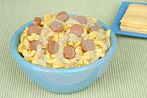 Macaroni and cheese with sliced hotdogs