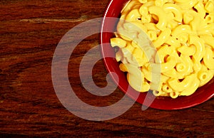 Macaroni and cheese on wood background