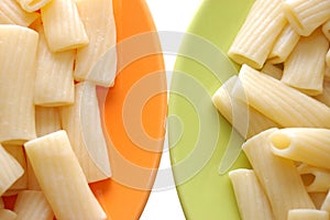 Macaroni foods in orange and green plates