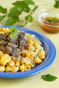Macaroni and fry chicken hearts
