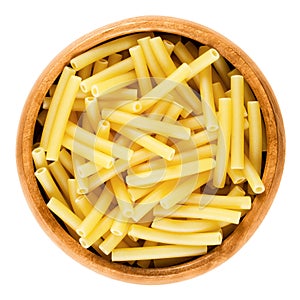 Macaroni pasta in wooden bowl, Italian maccheroni