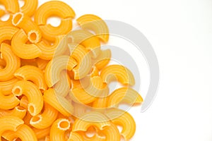 Macaroni top view on white background / close up raw macaroni uncooked delicious pasta or penne noodles