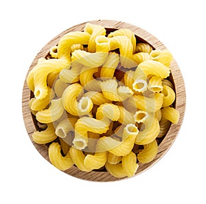 Macaroni in wooden bowl on white background Top view