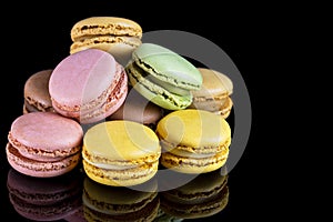 Macarons on a black background. Typical french sweet