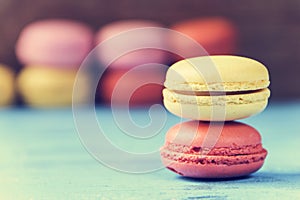 Macarons on a blue rustic surface, cross processed