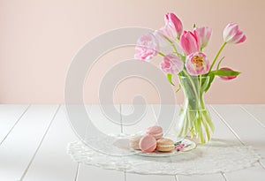 Macarons on plate with tulips