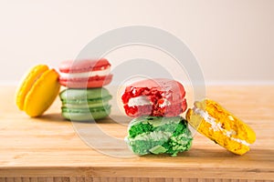 Macaroon color cake on a wooden board