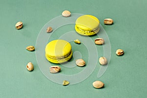Macaroon cookies with pistachio flavor on a green background