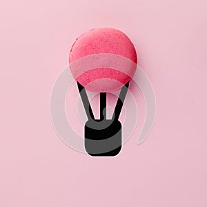 Macaroon or macaron in the form of hot air balloon flying in the air