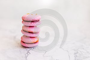 Macaroons close up. Pink macaroons on the murble table