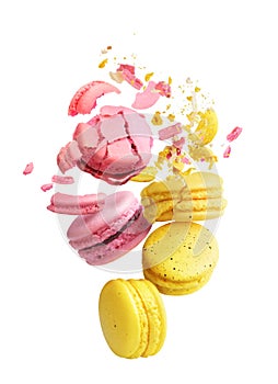 Macaroons with crumbs flying on a white background