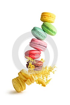 Macaroons with crumbs on a white background