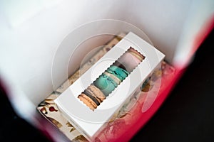 Macaroons dessert gift,traditional french colorful macaroons in a rows in a box. French macaroon cake. Sweet and