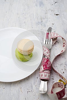 Macaroons dessert and a measuring tape