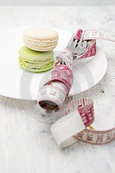 Macaroons dessert and a measuring tape