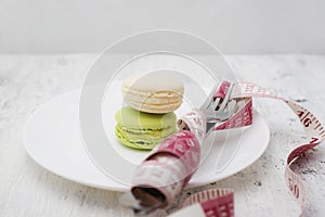 Macaroons dessert and a measuring tape