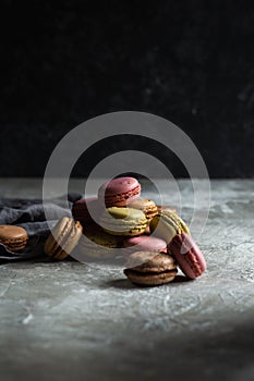 Macaroons on a gray background on a gray table