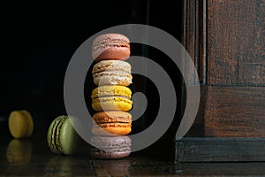 Macaroons on an old dark sideboard