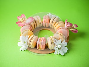 Macaroons over a green background