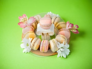 Macaroons over a green background