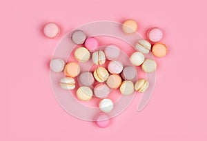 Macaroons in a pink background.