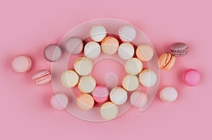 Macaroons in a pink background.