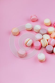 Macaroons in a pink background.