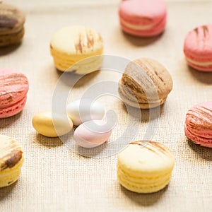 Macaroons with sweet eggs on a linen napkin
