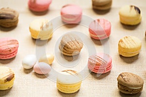 Macaroons with sweet eggs on a linen napkin