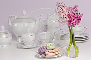 Macaroons and transparent vase with pink hyacinth flowers