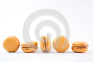 Macaroons on white background top, colorful yellow macaroons, selective focus