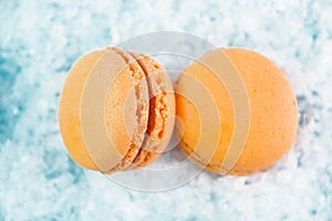 Macaroons on white snow background top, color macaroons, selective focus