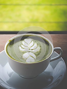 Maccha green tea in a white mug.