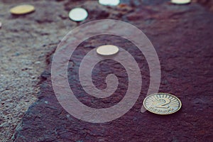 Macedonia currency two denar on the stone background. Photo depicts Macedonian valuta shiny denari metal coins, close up, macro v photo