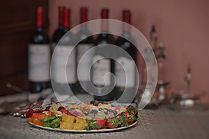 Macedonia on red wine bottles background photo