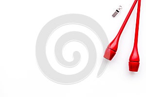 Maces for rhythmic gymnastics on white background top view copy space