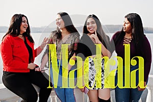 Machala city. Group of four happy and pretty latino girls from Ecuador photo