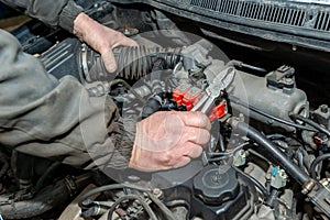 Machanic repairman at the LPG converted engine.