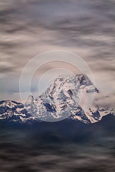 Machapuchare 6,993 m. means Fishtail with cloudy over the mountain,